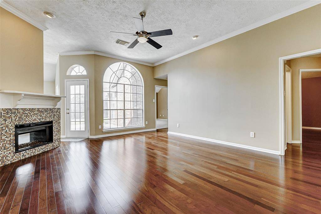 With its welcoming ambiance and abundant natural light, this family room sets the perfect stage for creating lasting memories, whether it's a lively game night or a heartwarming family gathering.