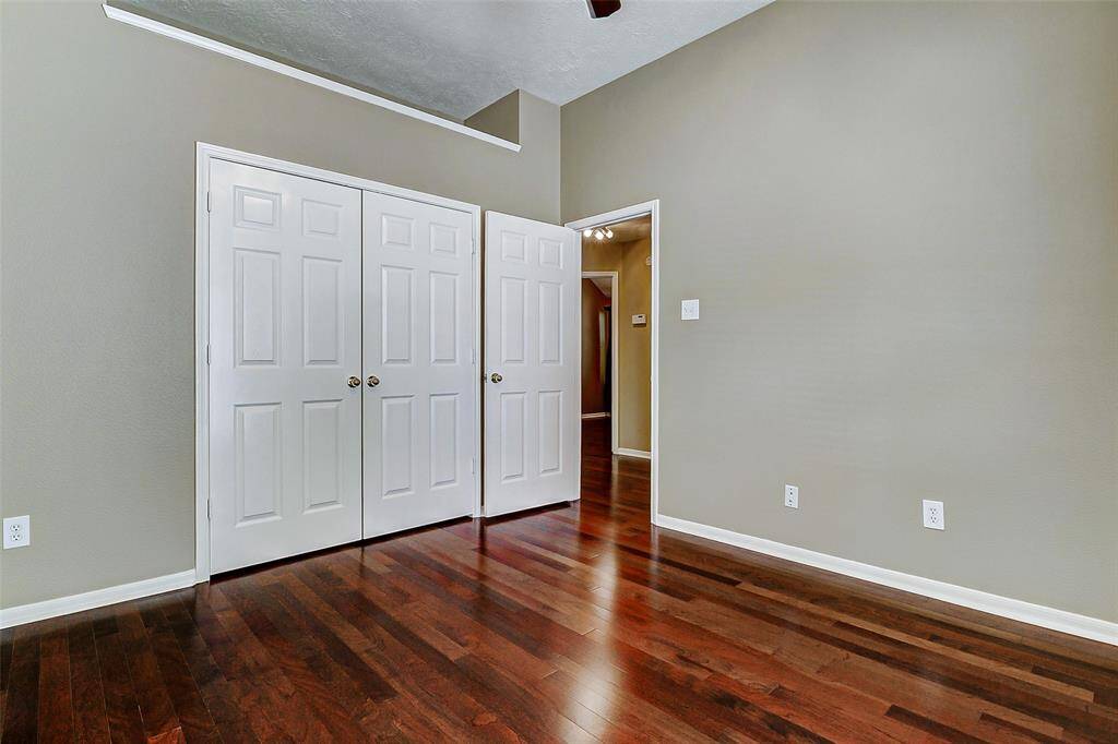 The well-appointed secondary bathroom offers the convenience of double sinks with a stylish granite countertop.