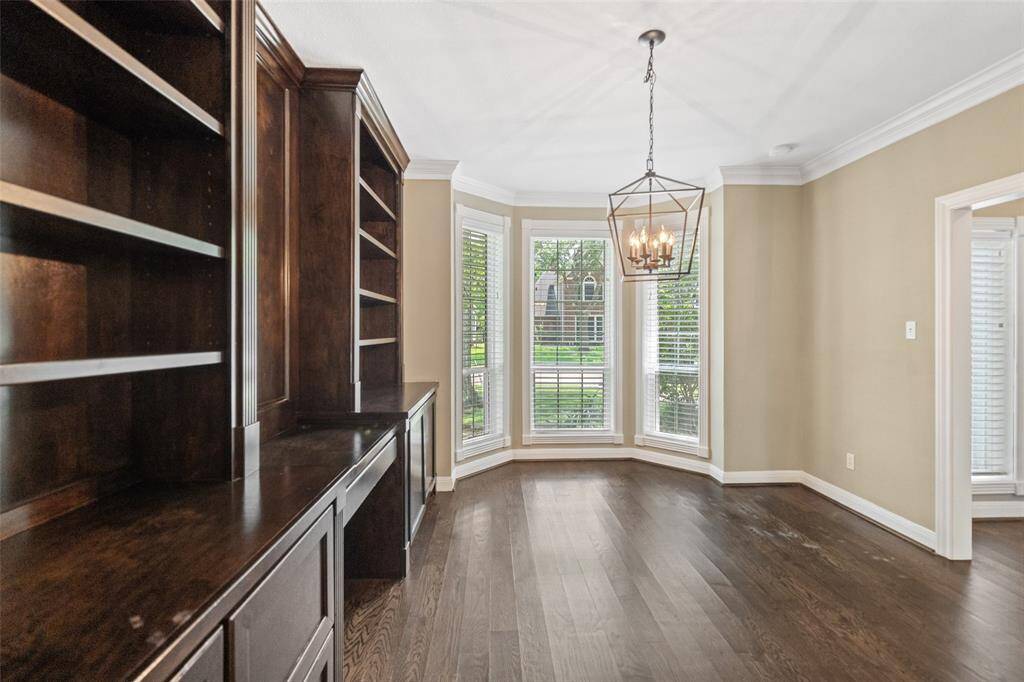 The dining room features bay windows.