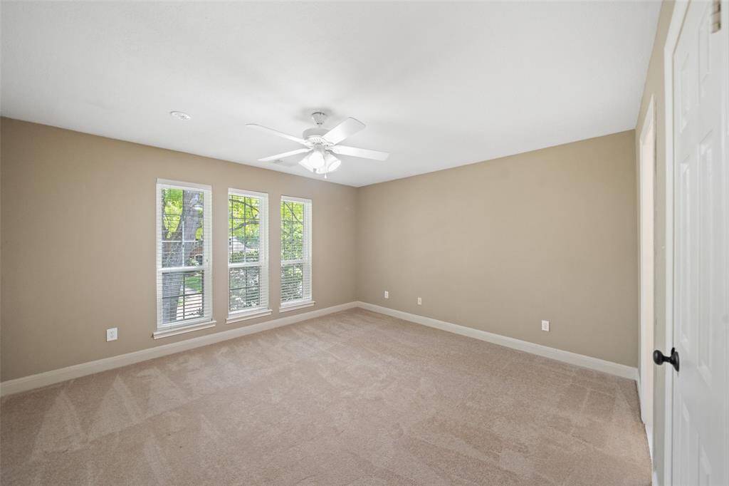 Located upstairs, a generously sized bedroom.
