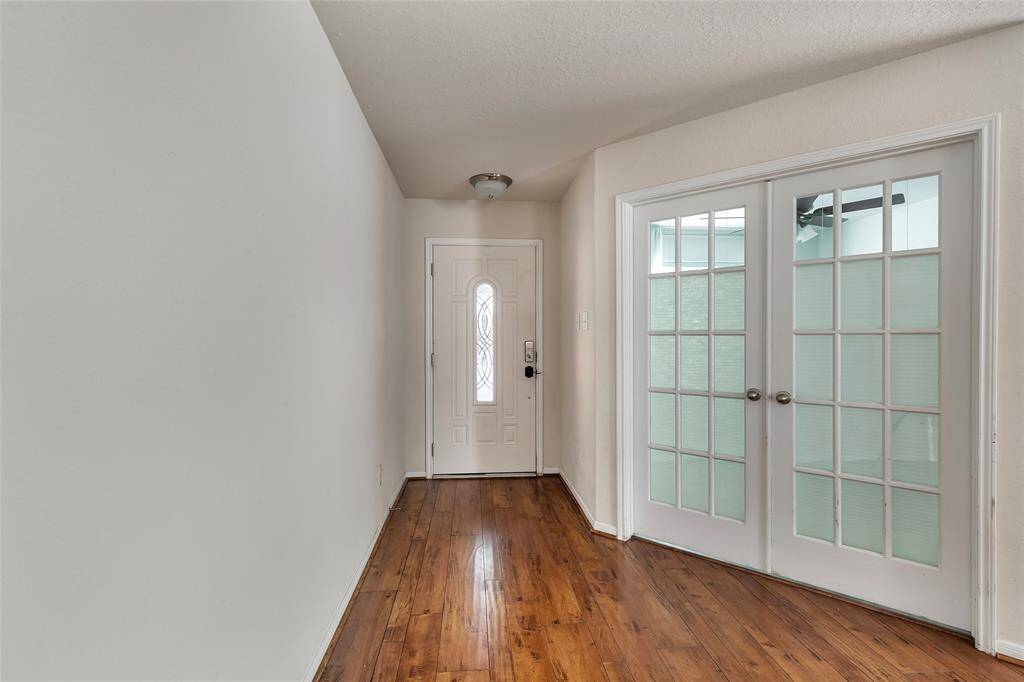 UPON ENTERING YOU WILL BE GREETED WITH BEAUTIFUL ENGINNERED WOOD FLOORS.