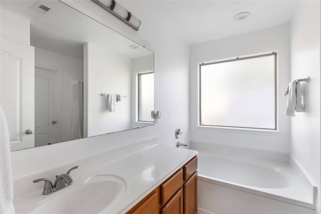 PRIMARY BATH WITH A NICE GARDEN TUB AND SEPERATE SHOWER