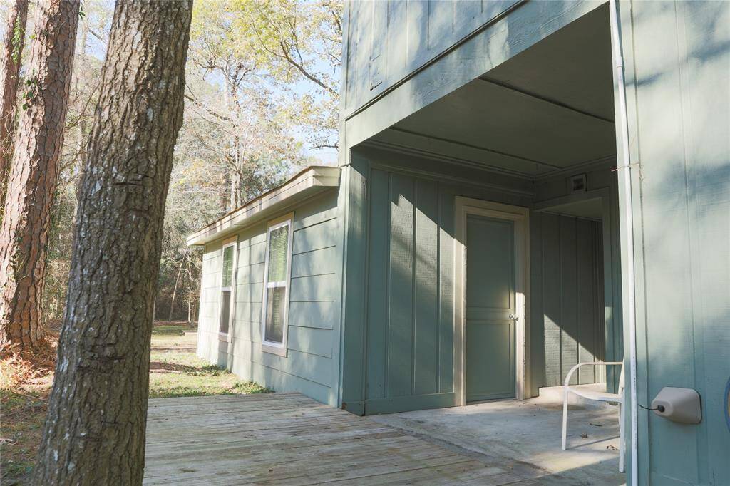 back of house with door to Bonus Room