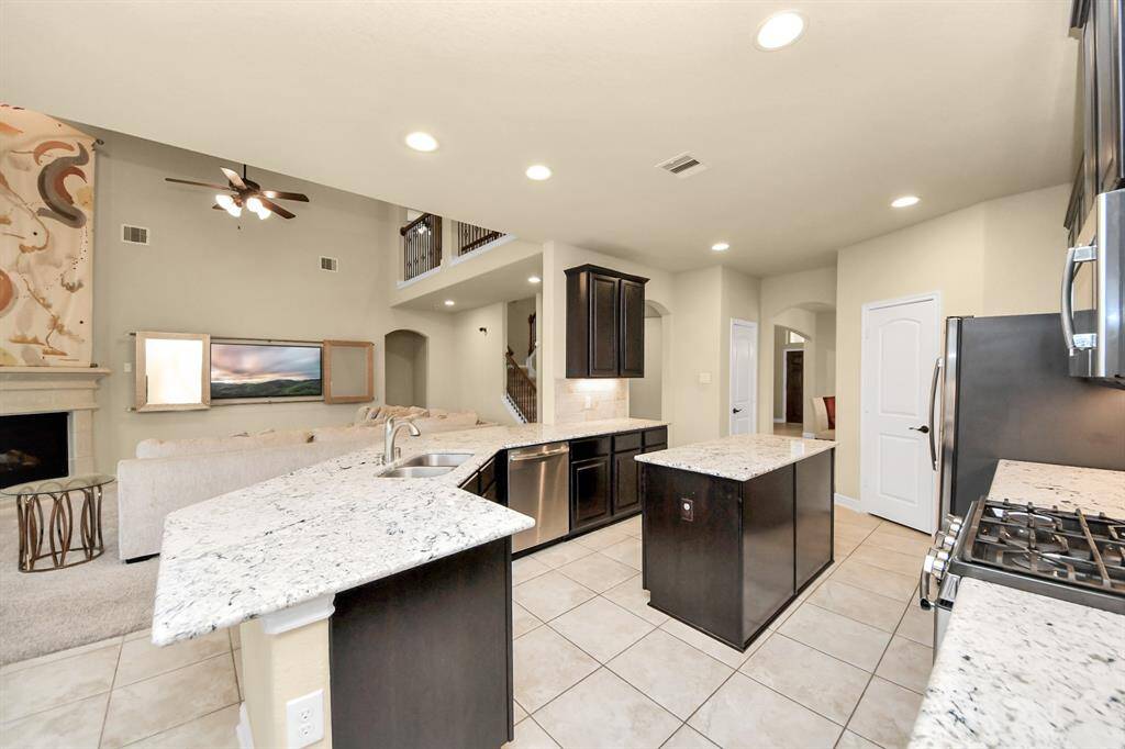 Counter stools are a perfect fit for an eat-in kitchen around the outer island.