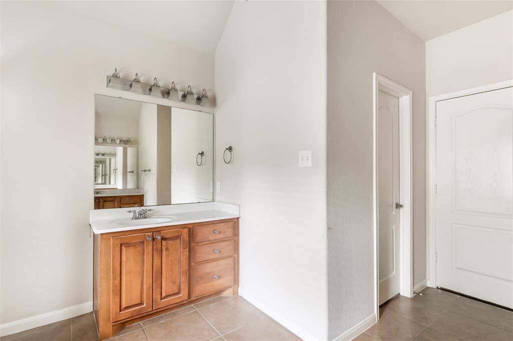 Dual vanities enhance the primary bath for added convenience and style.