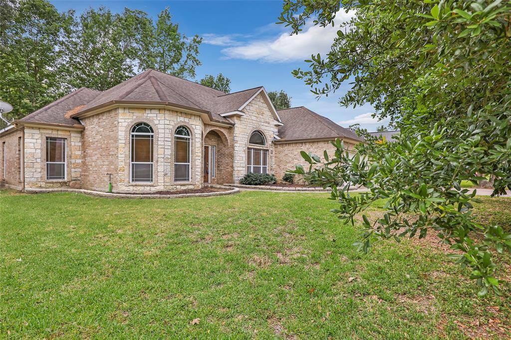 Spacious 2,194 sq ft home with charming stone exterior, nestled in a serene setting.
