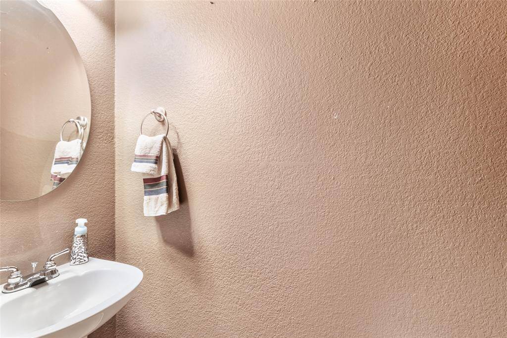 Cozy and convenient half bath with modern fixtures. Perfect for guests.