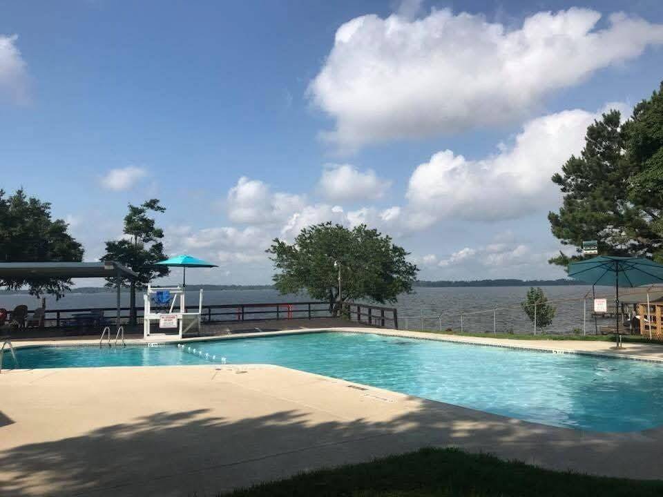 Enjoy serene lakeside relaxation at the inviting neighborhood pool, perfect for unwinding and soaking up the sun.