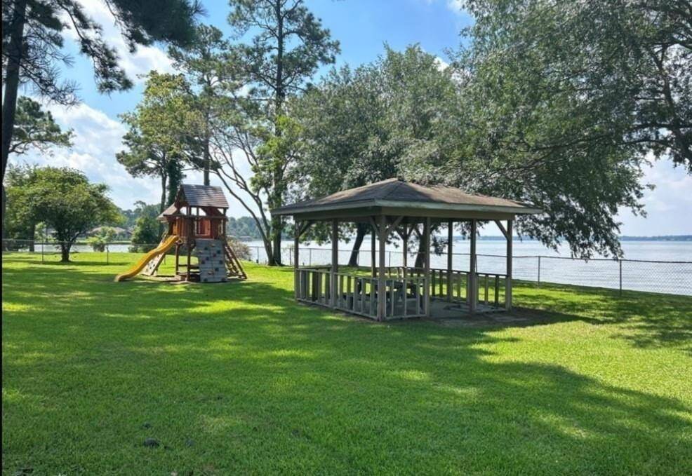 Charming neighborhood park featuring a scenic lakeside view, playground, and a cozy gazebo for relaxation. Perfect for families and nature lovers.