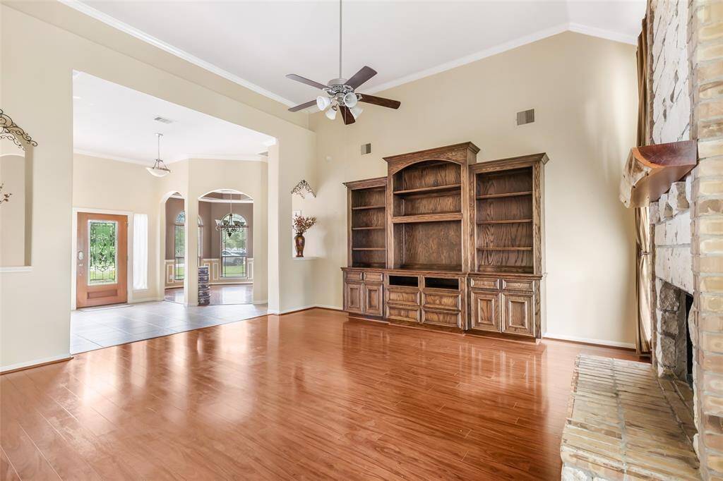 Elegant living room featuring a custom built-in entertainment center, perfect for showcasing your style and organization.