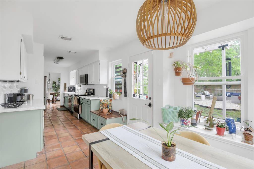 Kitchen is open to your breakfast nook and a door leading to the outdoor space