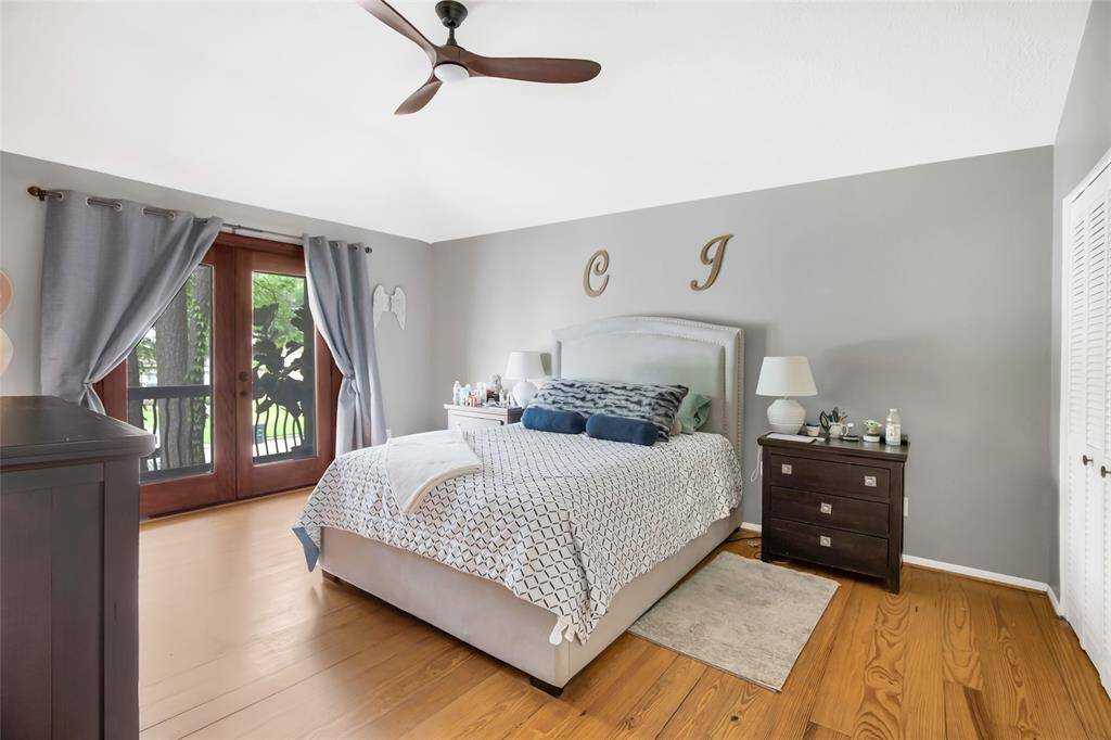 Primary bedroom with a balcony