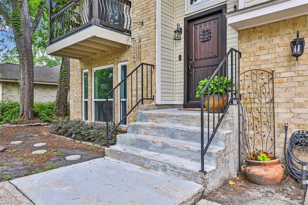 Grand entrance with a custom front door