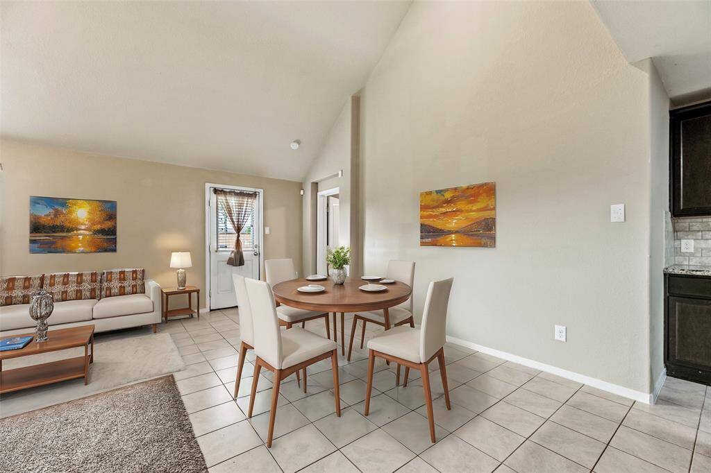 The dining area is perfect for a full-sized table and boasts easy care tile floors with easy access to the kitchen and backyard.