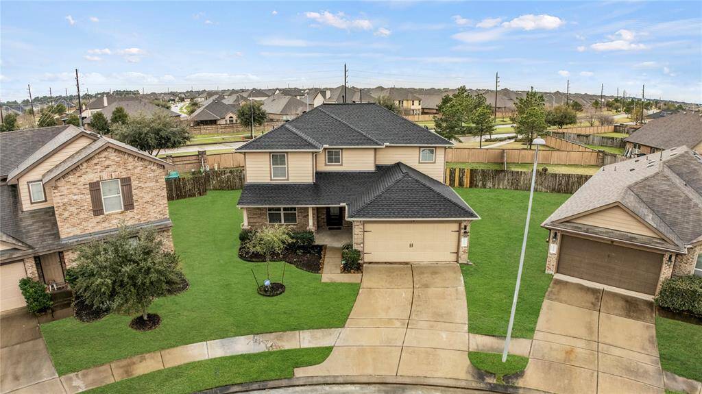 From this aerial view of the home, you can fully appreciate the prime lot location, its beauty, elegance, and remarkable charm.