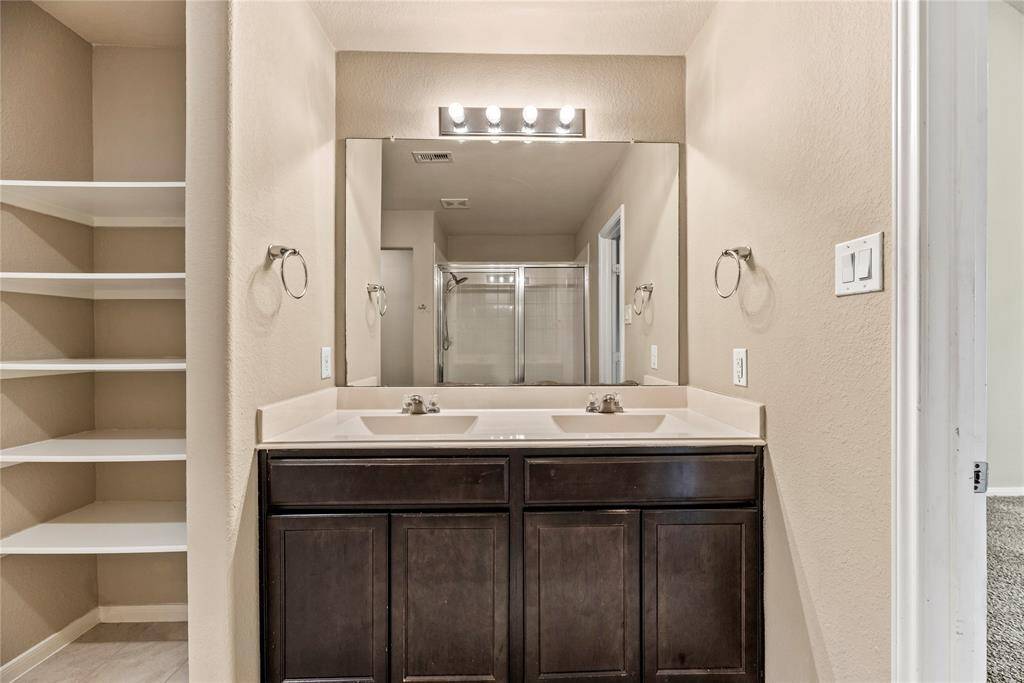 Dual vanities in your primary bath, offer personal space with tons of dedicated cabinet space.