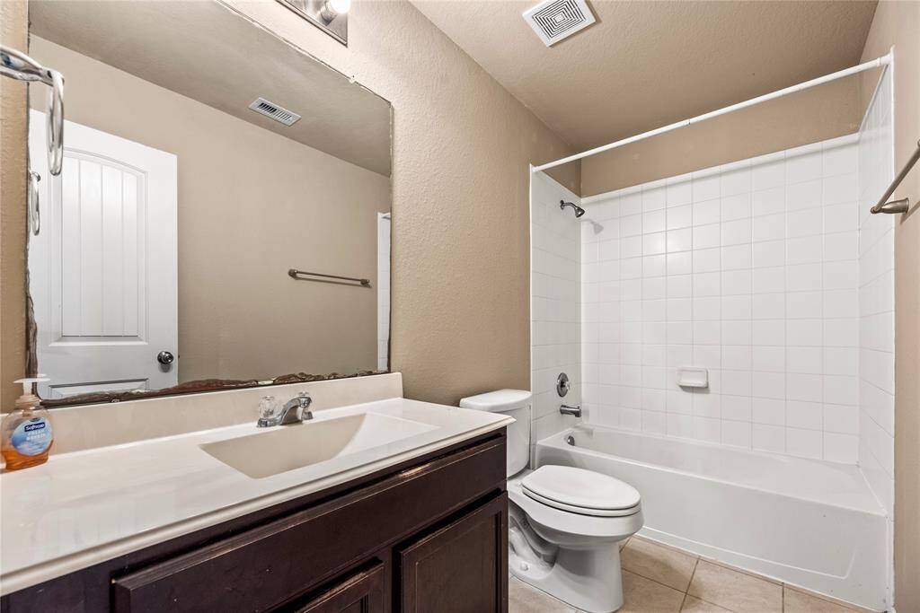 Another upstairs bath ensures space for everyone.