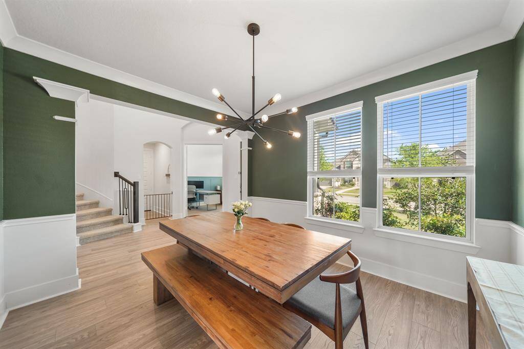 Open flow from dining to kitchen and foyer, perfect for entertaining.