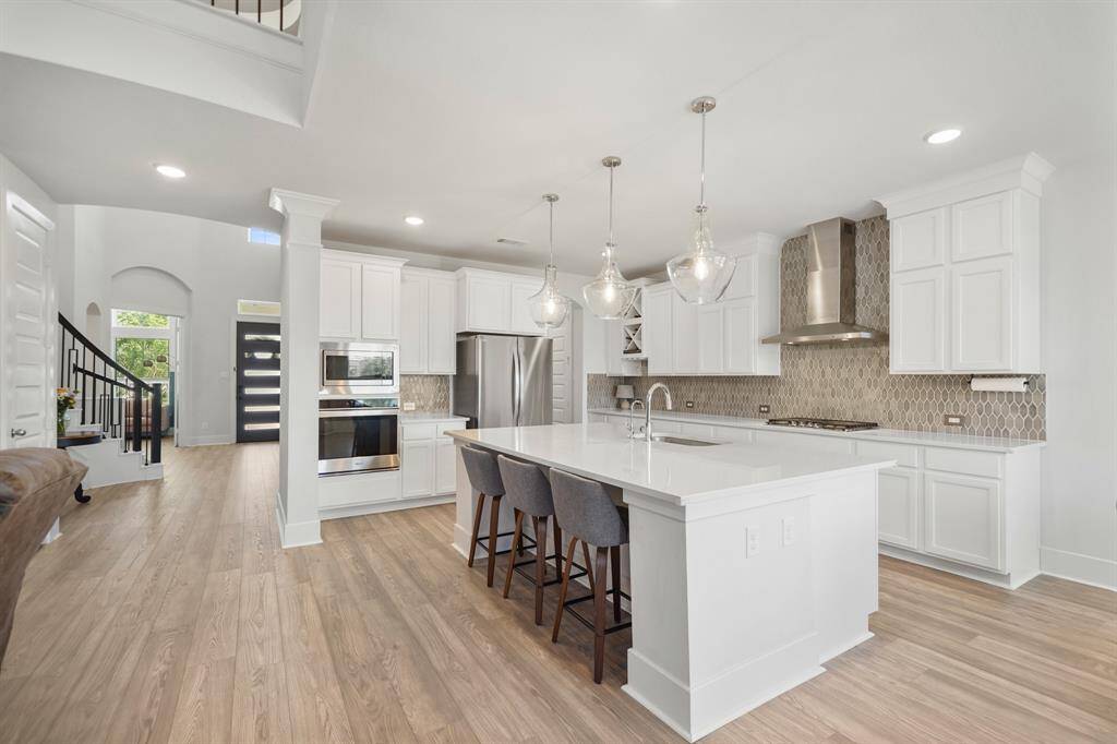 Ample cabinetry and walk-in pantry for extra storage.