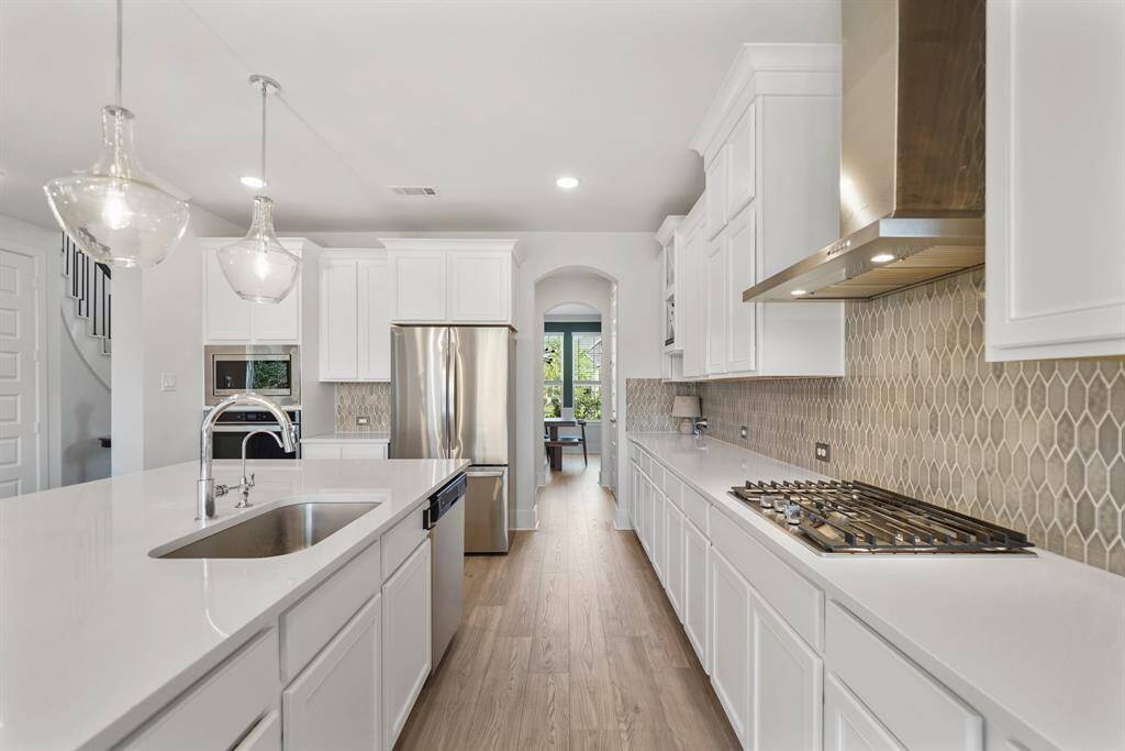 Sleek stainless steel appliances and modern finishes.