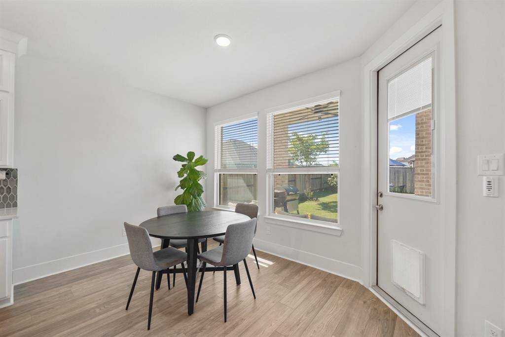 Breakfast nook with backyard views for relaxed dining.