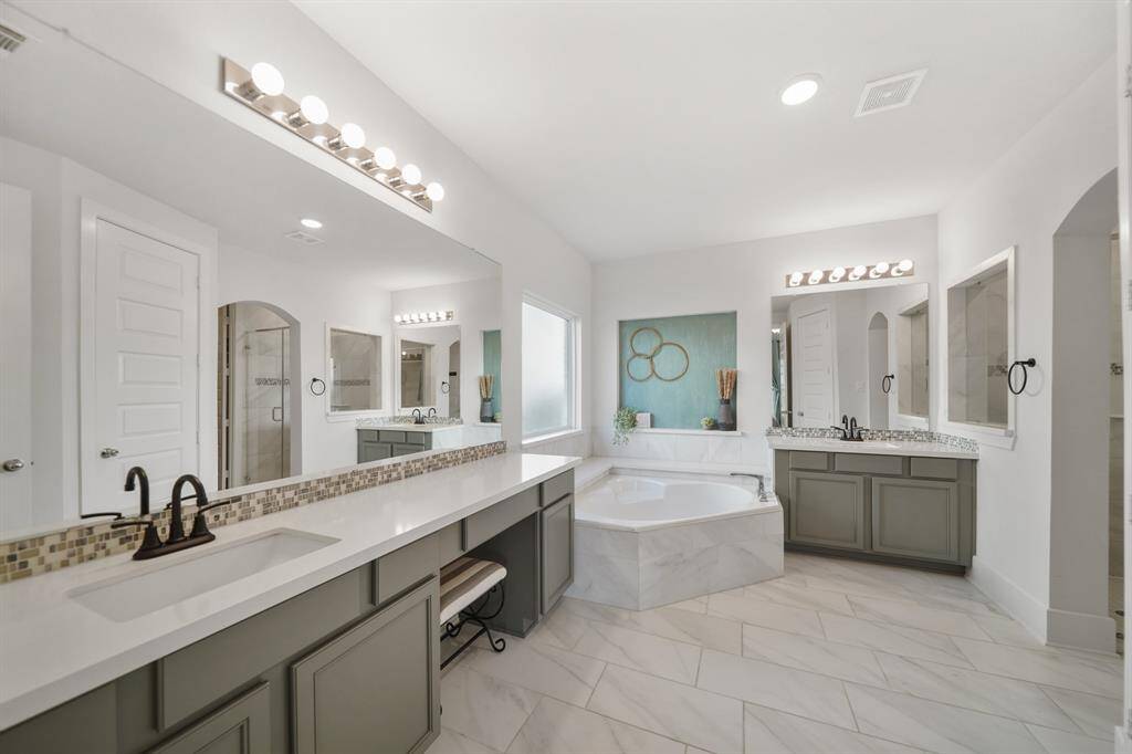 Ensuite bathroom with dual sinks and extended vanity.