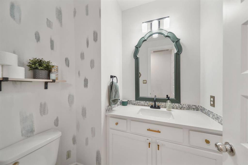 Guest half-bath on the main floor with elegant touches.