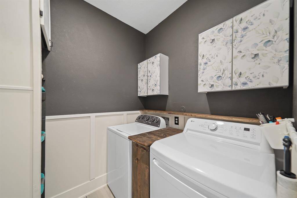Laundry room with built-in storage and folding space.
