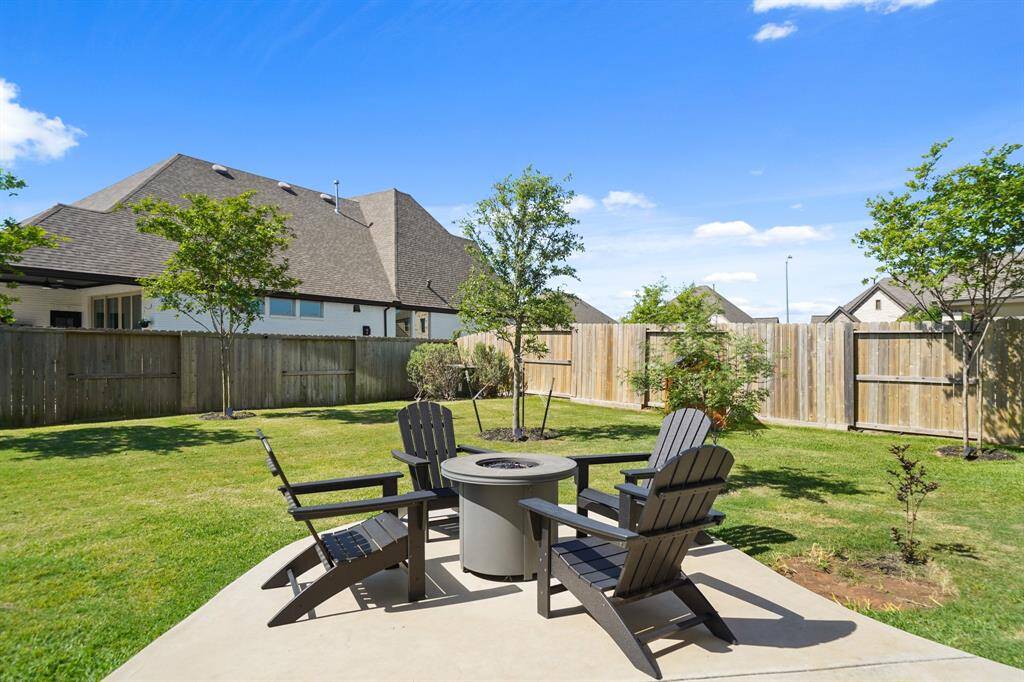 Dedicated fire pit area on the extended slab—perfect for chilly evenings, roasting s’mores, or hosting under the stars.