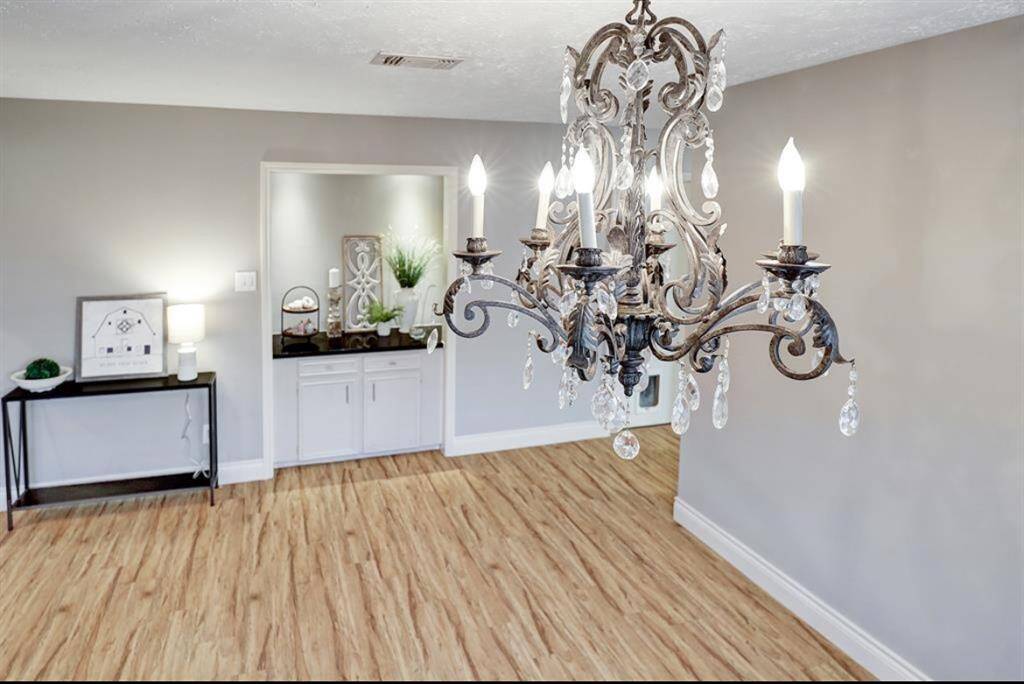 Formal dinning with a stunning chandelier