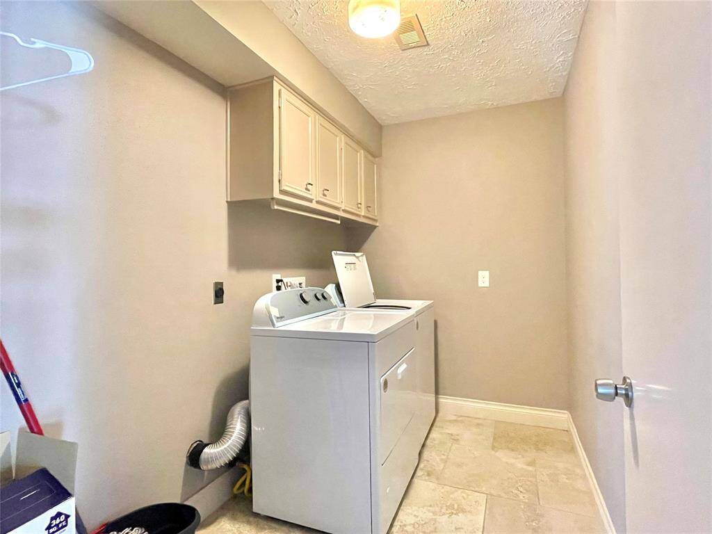 Big Laundry room with washer and dryer ready