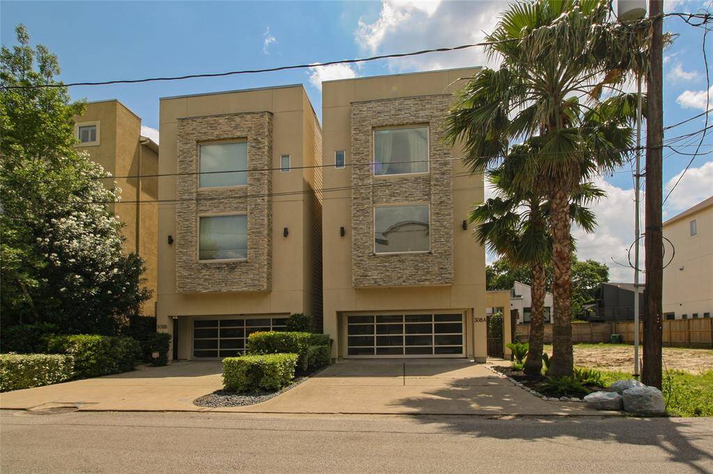 Free standing townhome with double wide driveway & gated front entry. (#A is the Home on the Right)
