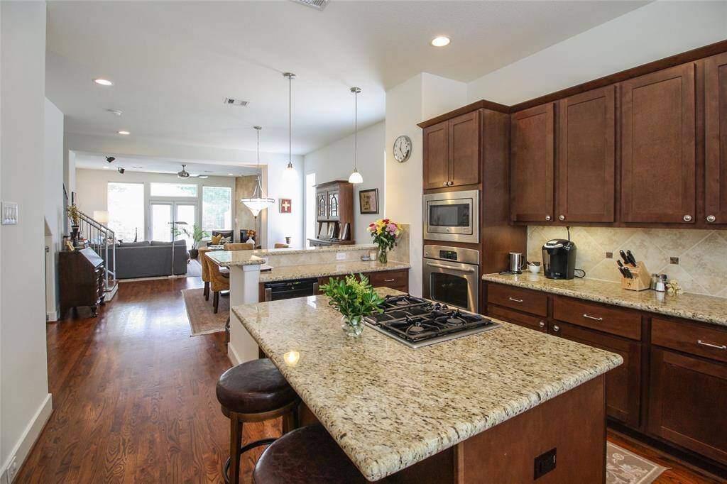 Enjoy entertaining for one or many with this amazing open concept floorpan, while still keeping designated kitchen, dining, and living areas. The perfect layout!