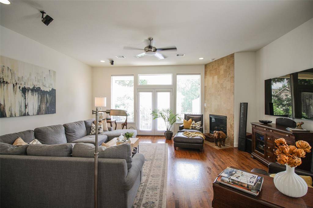 Again, the amount of windows allow for light to fill the space, even glass French doors! This room is spacious and fits oversized furniture easily!