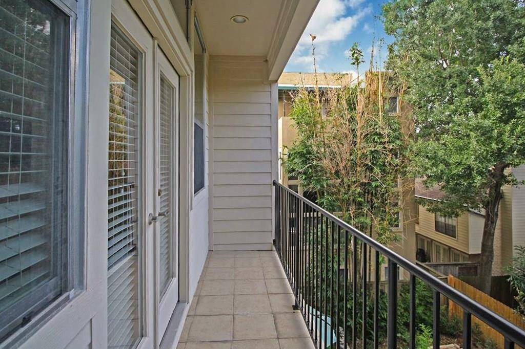 This is the private covered balcony off of the master suite that looks out to the back patio/yard.