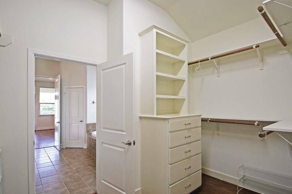 This closet is even larger in person. Great built-in dresser with shelving!