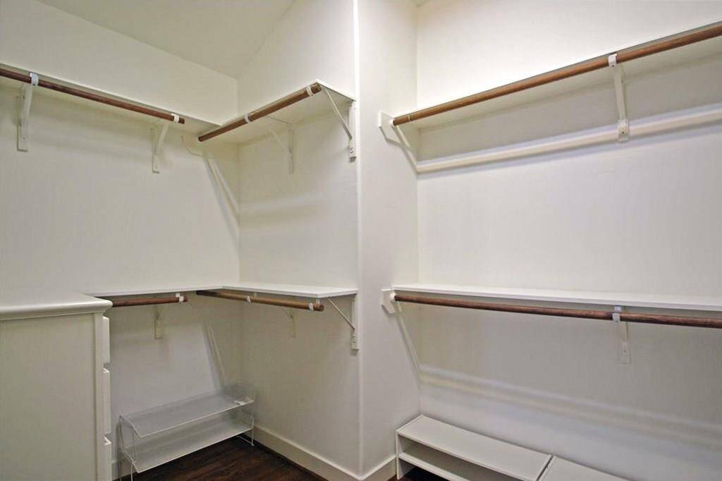 The hanging racks wrap the inside of this closet!