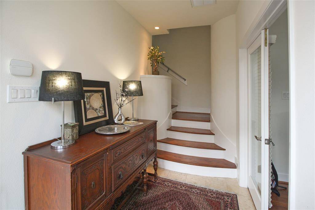 Gorgeous foyer entry with Travertine floors, the 1st floor bedroom is to the right.
