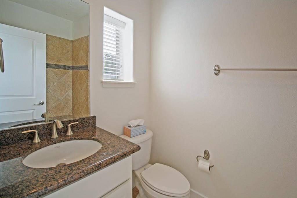 This is the private bathroom with full Tub/Shower, granite counters, and again, another window so you always have natural light!