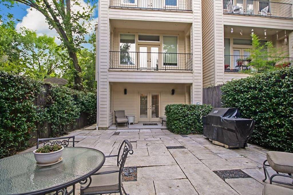 The backyard is paved in stone for easy maintenance. You may enter the backyard through first floor bedroom or through the front door (so the bedroom can remain private), either way it is fully gated!