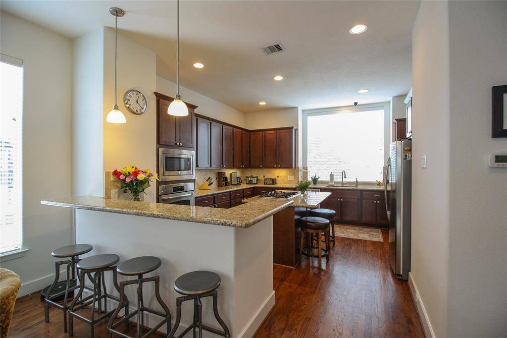 Breakfast bar and island counter seating make this kitchen an amazing place for gatherings.