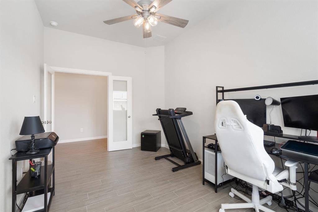 Further down the front entryway is a separate office / study area. Double doors to help privacy while working.
