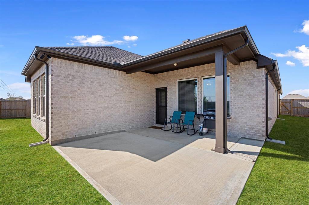 Oversized back patio partially covered and partially open. Plenty of space to relax and unwind after a day's hard work.