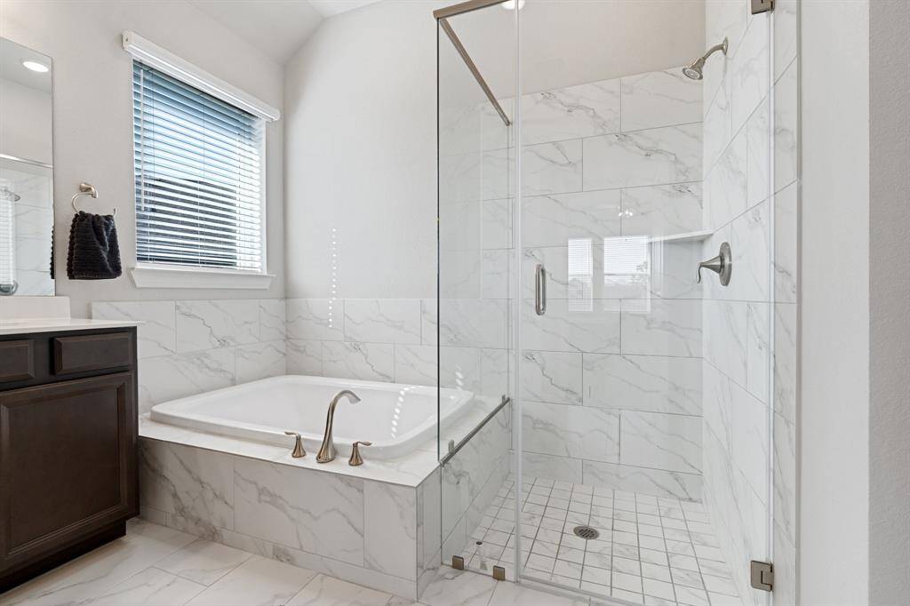 Pretty white and grey tile makes this bathroom feel like a spa.