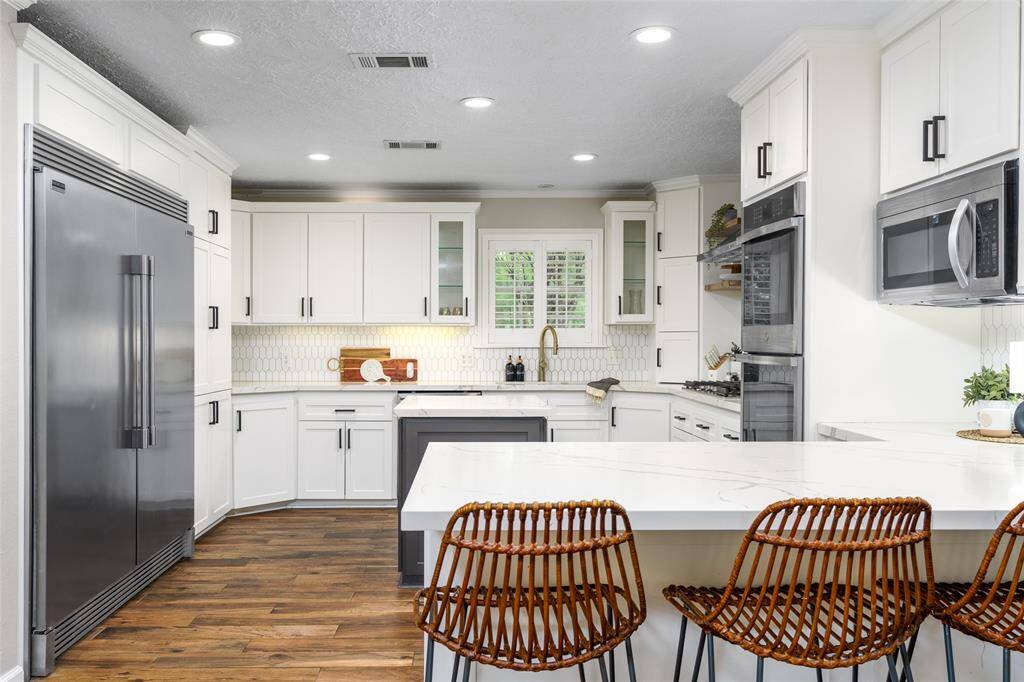 Remodeled kitchen with SS appliances.