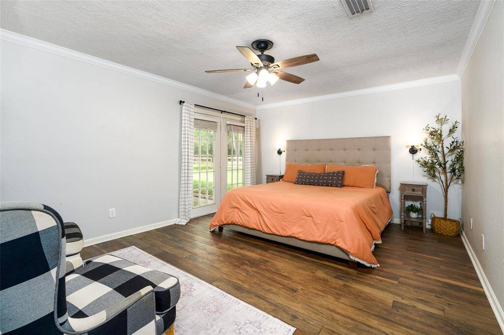 Primary suite with french doors to outside.