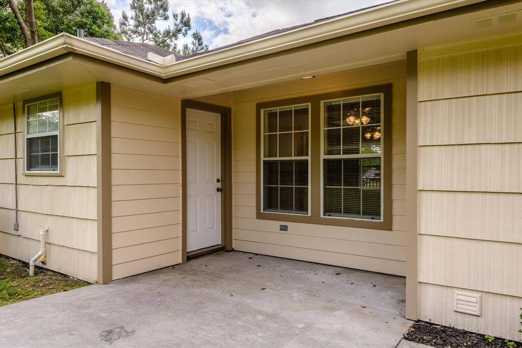 Covered back porch with very cute potential