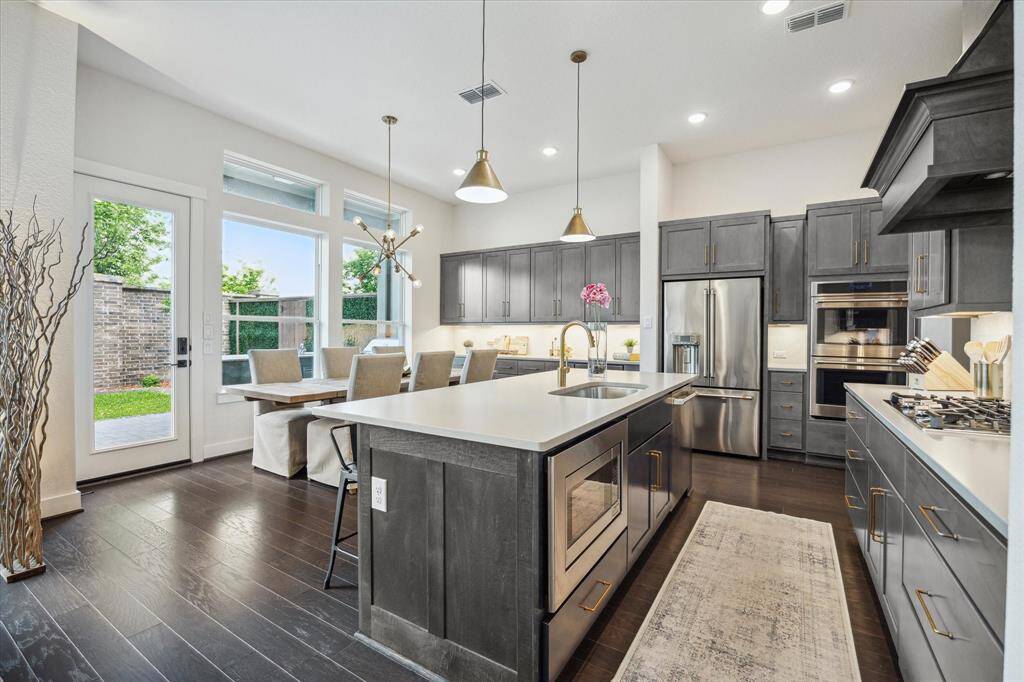 Upgraded Kitchen with GE Café Line Appliances – Double oven & premium finishes for achef-inspired experience.