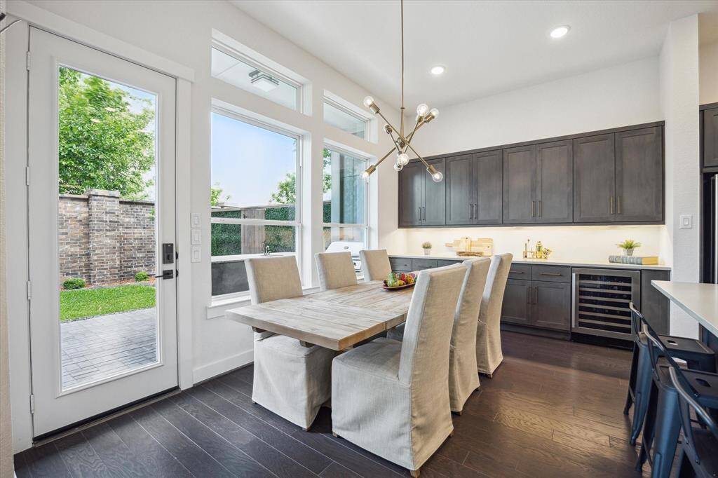 Ding room off the kitchen featuring a built-in buffet with wine chiller.