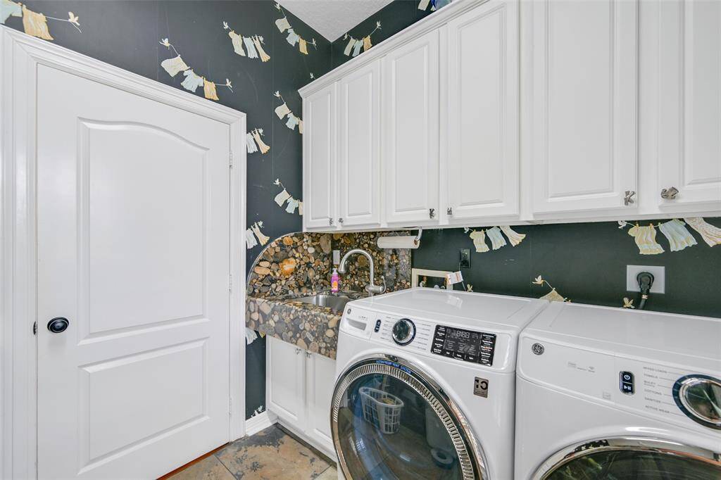 Oversized laundry room with sink & freezer space